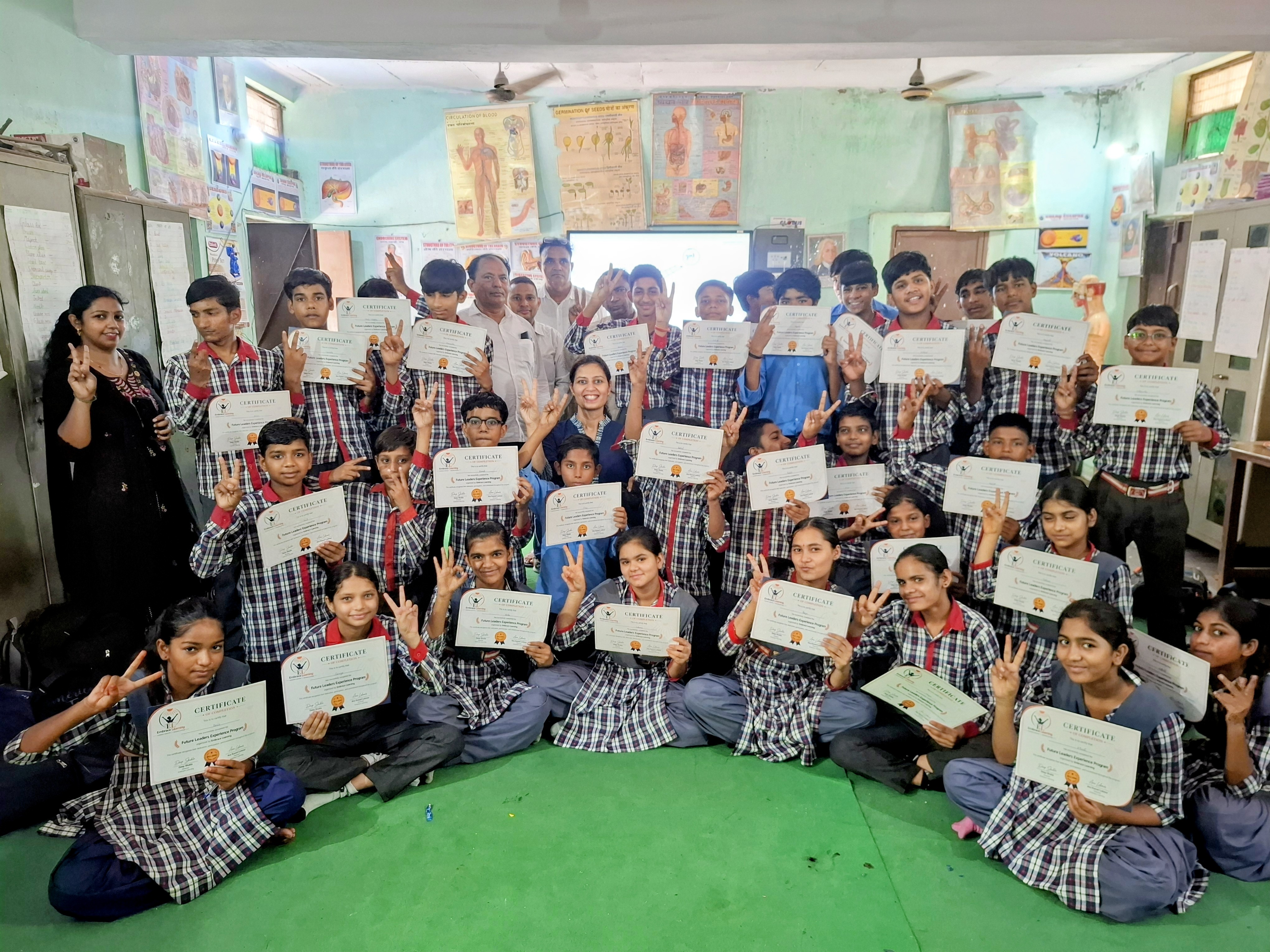 Students receiving certificates after the Future Leaders Experience Program